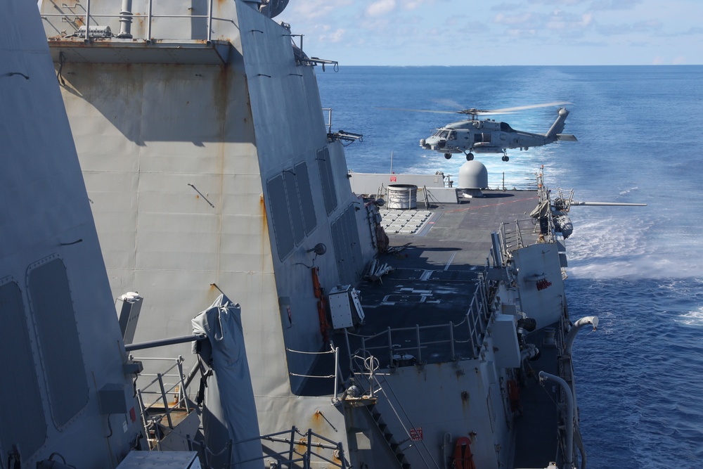 Sailors aboard the USS Howard conduct flight quarters in the South China Sea