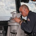 Sailors aboard the USS Howard stand watch in the pilothouse in the South China Sea