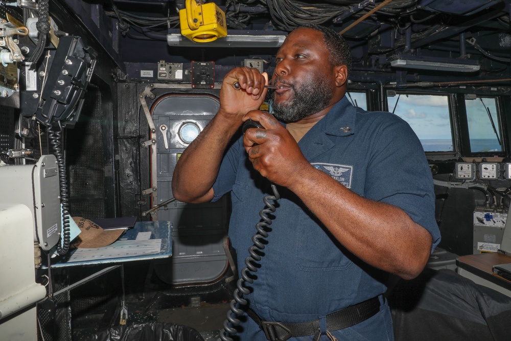 Sailors aboard the USS Howard conduct flight quarters in the South China Sea