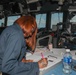 Sailors aboard the USS Howard stand watch in the pilothouse in the South China Sea