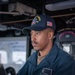 Sailor Stands Helmsman Watch Aboard USS William P. Lawrence