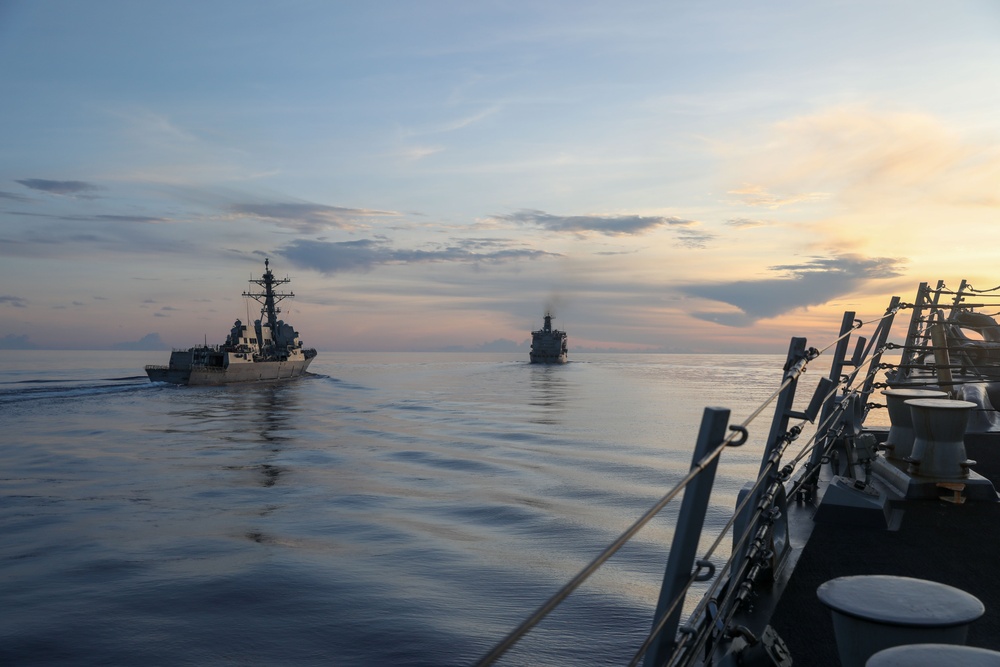 Sailors aboard the USS Howard conduct a replenishment-at-sea with the USNS John Ericsson in the South China Sea