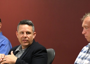 Col. Welde talks to new team members