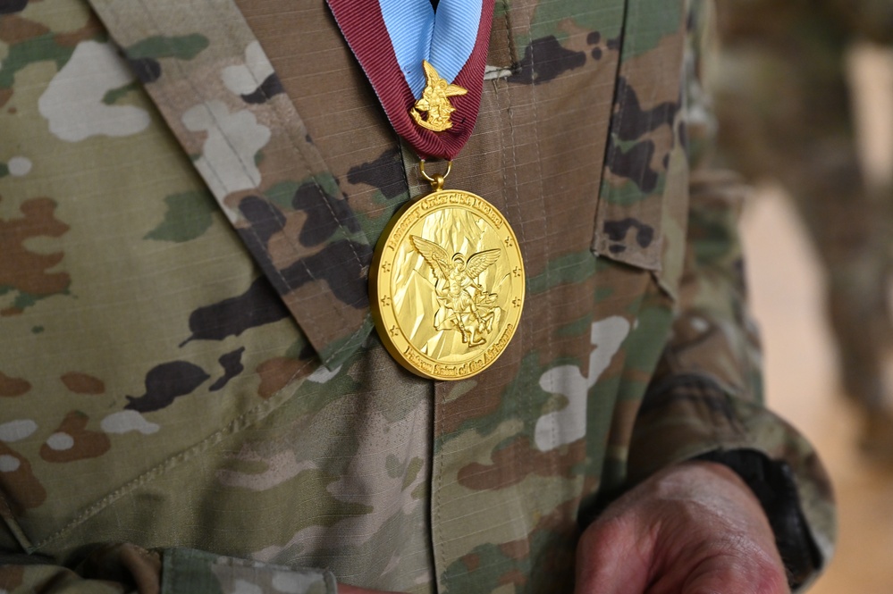 Col. Brian R. Deaton presented the Order of Saint Michael-Airborne