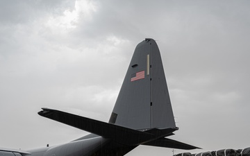 Airmen load two AFCENT C-130s with humanitarian aid bound for Gaza