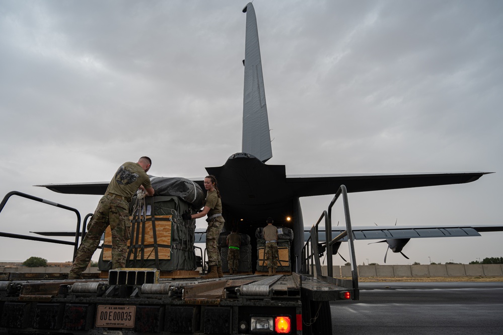 Airmen load two AFCENT C-130s with humanitarian aid bound for Gaza
