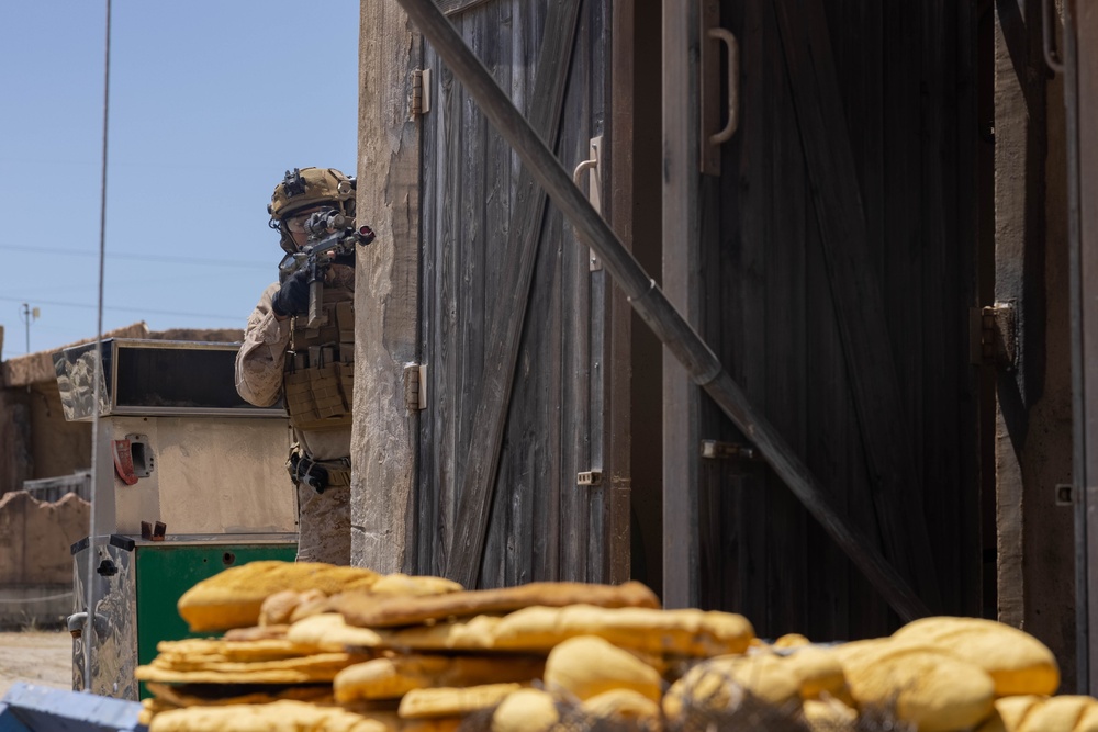 3rd Bn., 4th Marines patrols through infantry immersion trainer