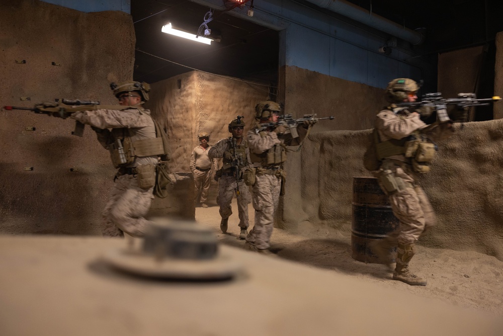 3rd Bn., 4th Marines patrols through infantry immersion trainer