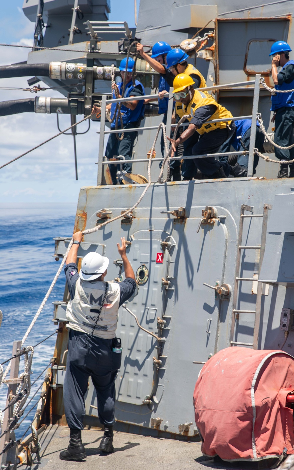 USS Russell (DDG 59) refuels and replenishes at sea with the USNS John Ericsson (T-AO 194)