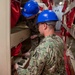USS Makin Island Sailors Replace EEBD Rack Housings
