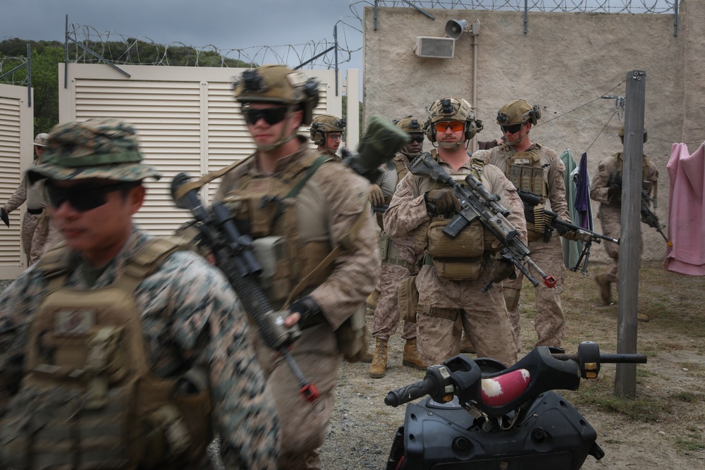 3rd Bn., 4th Marines patrols through infantry immersion trainer