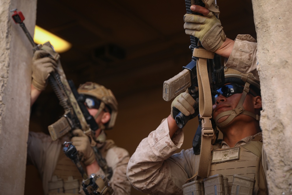 3rd Bn., 4th Marines patrols through infantry immersion trainer