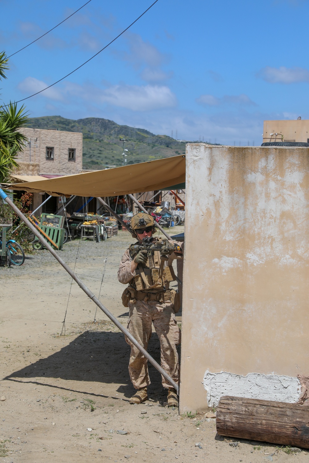 3rd Bn., 4th Marines patrols through infantry immersion trainer