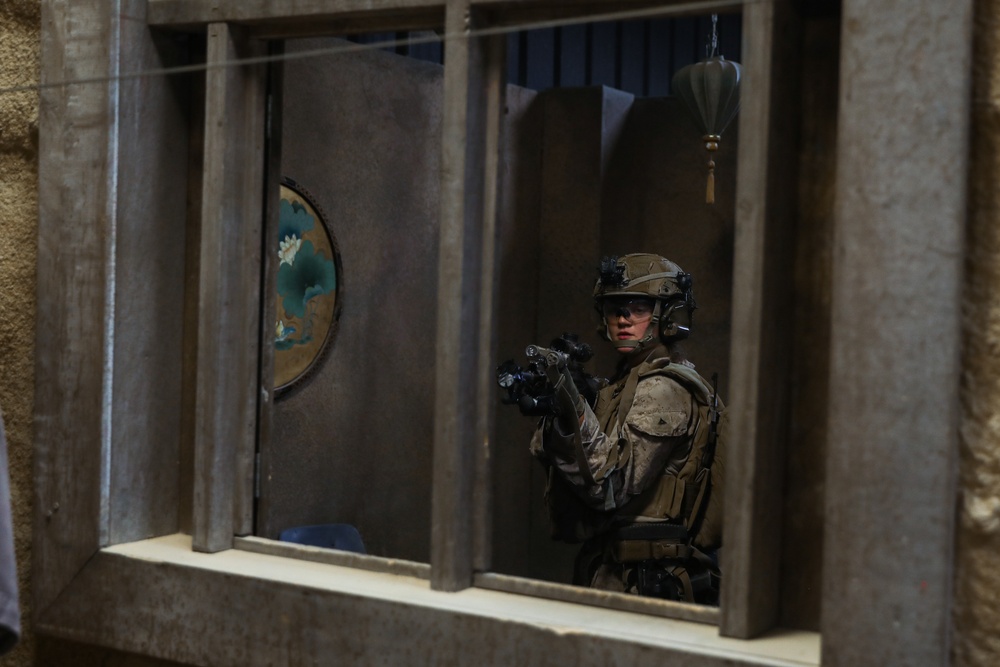 3rd Bn., 4th Marines patrols through infantry immersion trainer