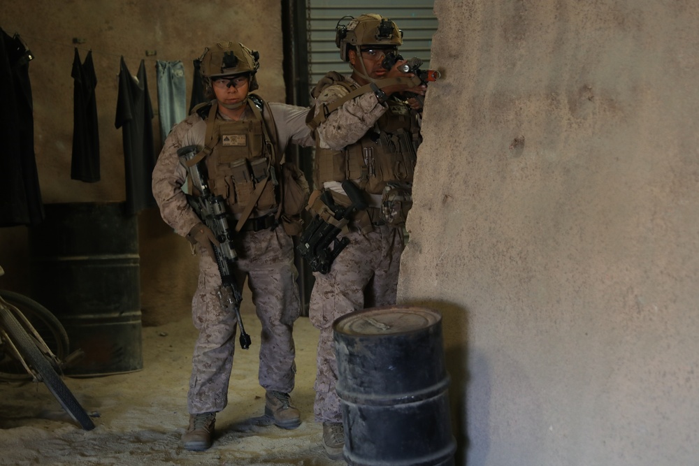 3rd Bn., 4th Marines patrols through infantry immersion trainer