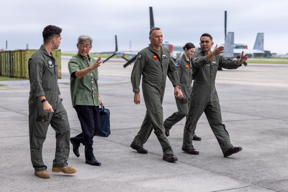 Members of the Ministry of Foreign Affairs of Japan tour MV-22B Osprey aircraft, simulator