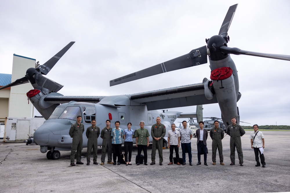 Members of the Ministry of Foreign Affairs of Japan tour MV-22B Osprey aircraft, simulator