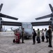 Members of the Ministry of Foreign Affairs of Japan tour MV-22B Osprey aircraft, simulator