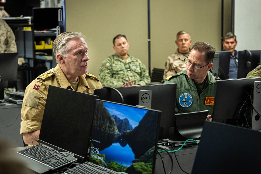 The Combat Center demonstrates capabilities to naval attachés from various nations