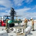 USS Frank Cable Sailors Assist Weapons Load of Mark 48 Torpedoes on USS Annapolis