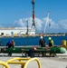 USS Frank Cable Sailors Assist Weapons Load of Mark 48 Torpedoes on USS Annapolis