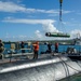 USS Frank Cable Sailors Assist Weapons Load of Mark 48 Torpedoes on USS Annapolis