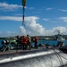 USS Frank Cable Sailors Assist Weapons Load of Mark 48 Torpedoes on USS Annapolis