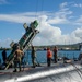 USS Frank Cable Sailors Assist Weapons Load of Mark 48 Torpedoes on USS Annapolis