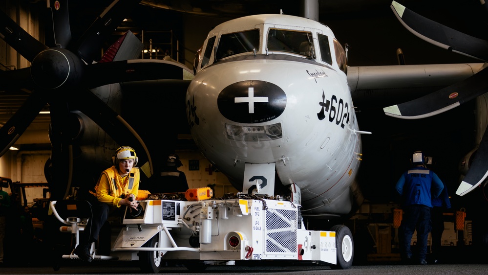 George Washington Sailors Move an E-2C Hawkeye