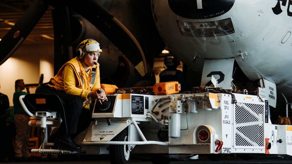 George Washington Sailors Move an E-2C Hawkeye