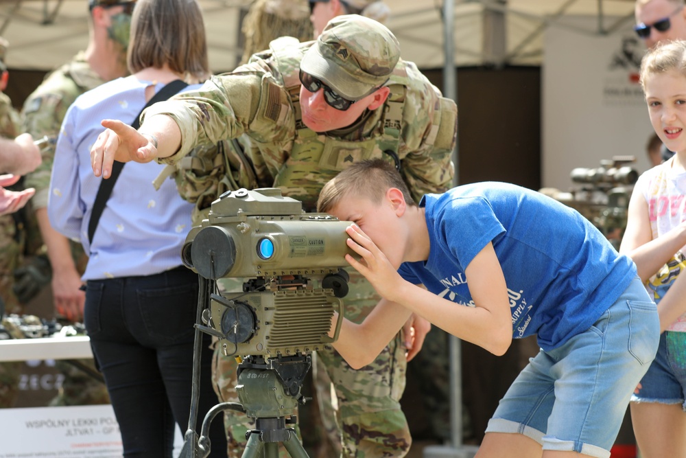 U.S. Army soldiers host a static display at a Polish Constitution Day celebration