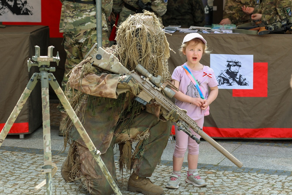 U.S. Army soldiers host a static display at a Polish Constitution Day celebration