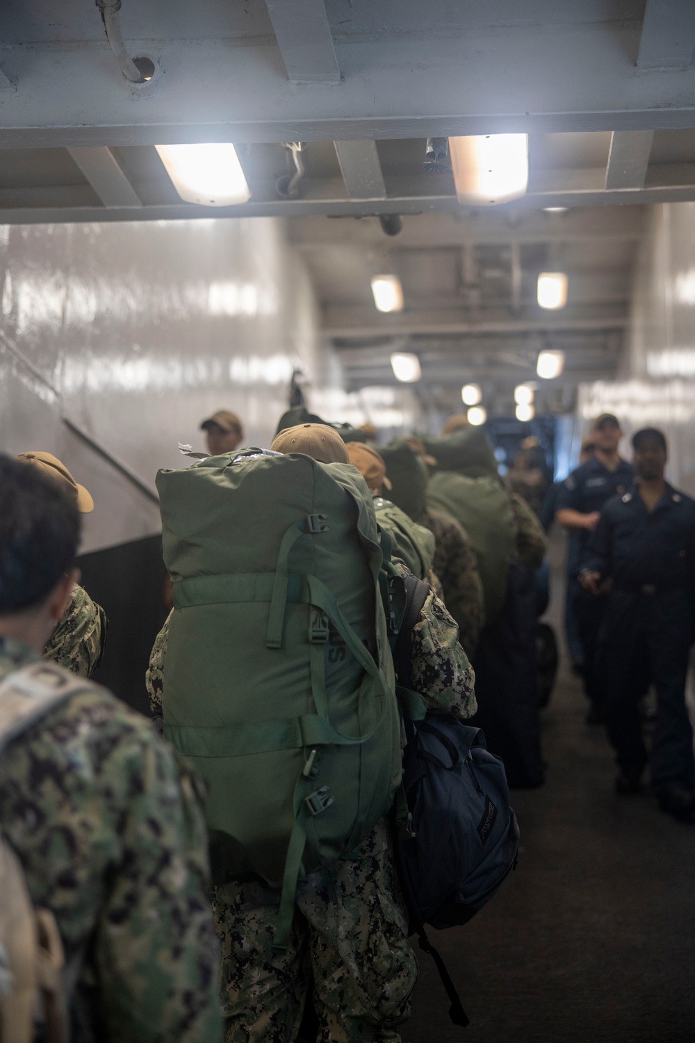 U.S. Sailors board the USS Bataan