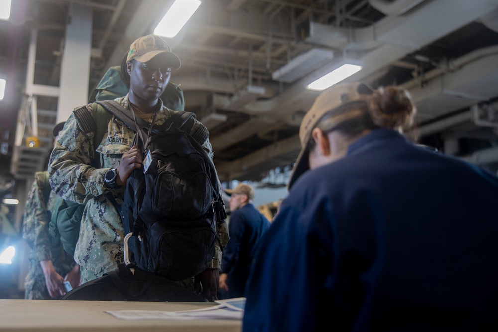 U.S. Sailors board the USS Bataan