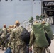 U.S. Sailors board the USS Bataan