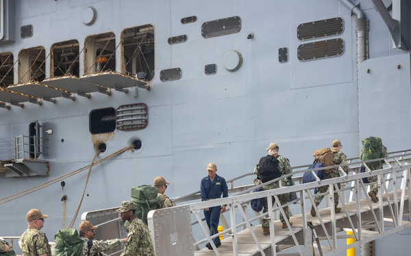 U.S. Sailors board the USS Bataan