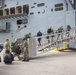 U.S. Sailors board the USS Bataan