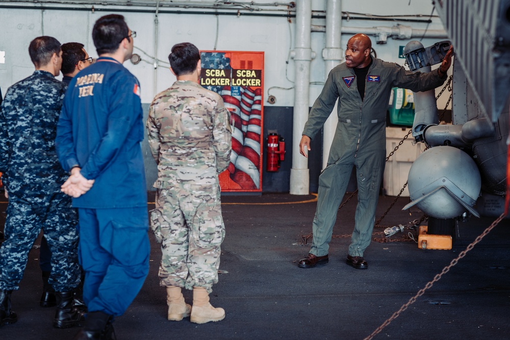 Commander of Carrier Air Wing (CVW) 7 teaches embarked international staff