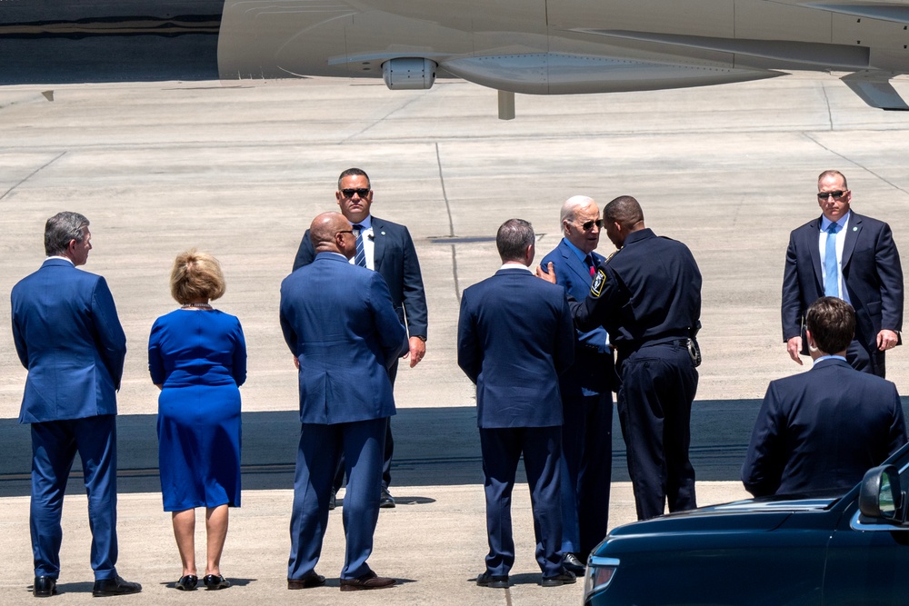 President Joe Biden pays respect to fallen law enforcement officers at the 145th Airlift Wing