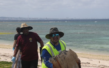 Volunteers on Okinawa work together to beautify beach on Earth Day