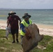 Volunteers on Okinawa work together to beautify beach on Earth Day