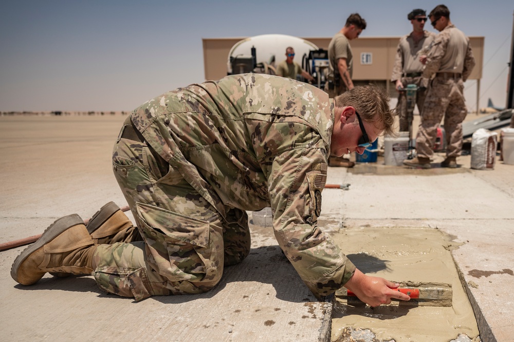 U.S. Air Force and Marine Corps conduct flightline repairs demonstrating joint integration