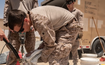 U.S. Air Force and Marine Corps conduct flightline repairs demonstrating joint integration