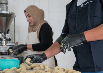 Despite facing significant challenges such as conflict displacement and increasing ingredient costs, this female business owner's dedication enabled her to resume her business and succeed.