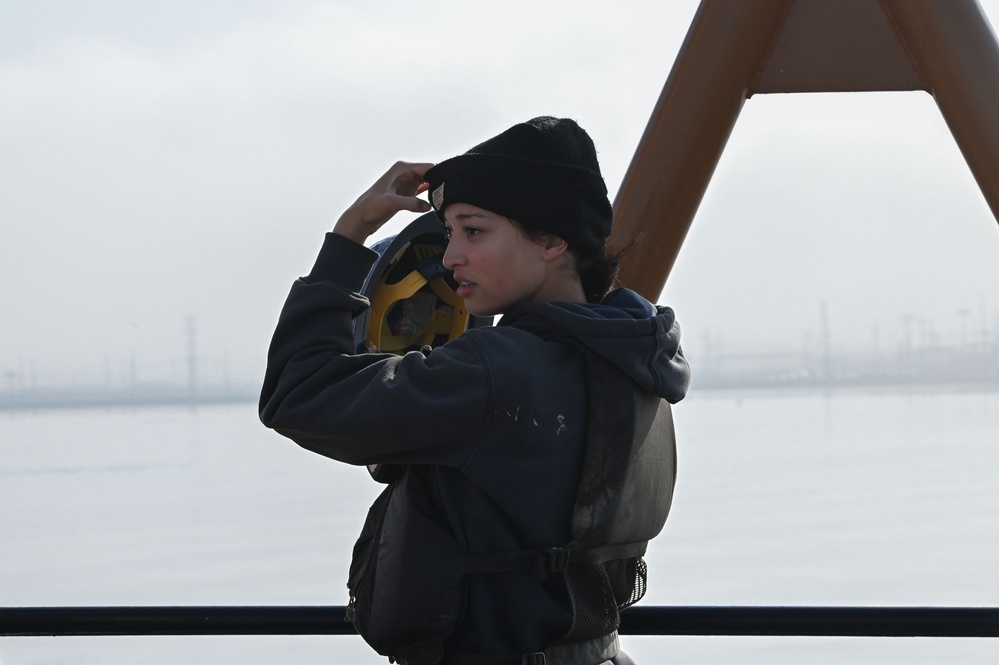 USCGC William Tate crewmember stands look-out watch