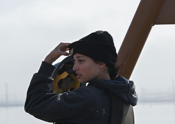 USCGC William Tate crewmember stands look-out watch