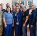 Brig. Gen. Christopher W. Cook and Command Sgt. Maj. Jodi Renner took a group photo with the leadership and staff of Columbus Regional Health