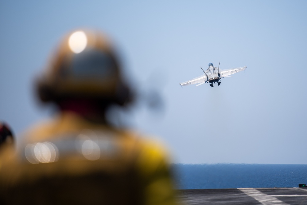 The &quot;Fighting Swordsmen&quot; of Strike Fighter Squadron (VFA) 32 Conduct an Airborne Change of Command Ceremony in the Red Sea