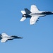 The &quot;Fighting Swordsmen&quot; of Strike Fighter Squadron (VFA) 32 Conduct an Airborne Change of Command Ceremony in the Red Sea