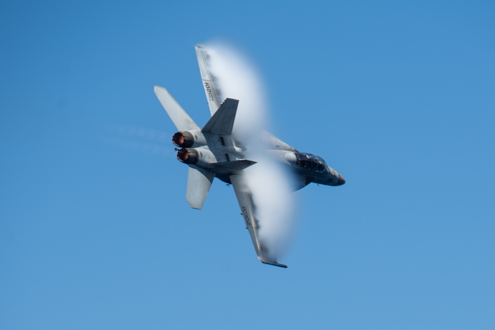 The &quot;Fighting Swordsmen&quot; of Strike Fighter Squadron (VFA) 32 Conduct an Airborne Change of Command Ceremony in the Red Sea